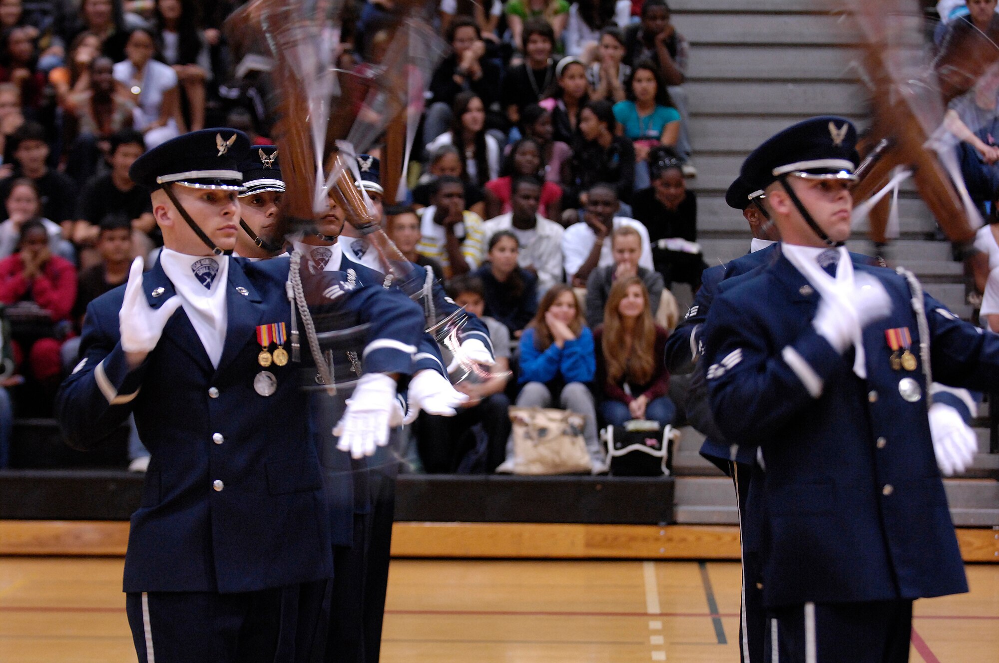 Members of the Air Force Honor Guard Drill Team perfom at Dr. Michael Krop Sr. High School near Miami, Fla. 2 May; the team joined local AF recruiters visiting Florida high schools before performing for JROTC cadets at the National High School Drill Team Competition. The Drill Team is the traveling component of the Air Force Honor Guard and tours world-wide representing all Airmen and showcasing USAF precision to recruit, retain, and inspire for the Air Force mission. (U.S. Air Force photo by Senior Airman Dan DeCook)(Released)