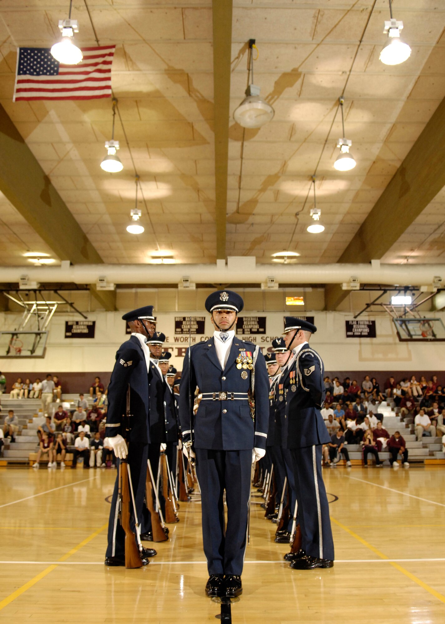 The Air Force Honor Guard Drill Team perfoms its large 16-man routine at Lake Worth Community High School in Lake Worth, Fla. 2 May. The team joined local AF recruiters visiting Florida high schools before performing for JROTC cadets at the National High School Drill Team Competition. The Drill Team is the traveling component of the Air Force Honor Guard and tours world-wide representing all Airmen and showcasing USAF precision to recruit, retain, and inspire for the Air Force mission. (U.S. Air Force photo by Senior Airman Dan DeCook)(Released)