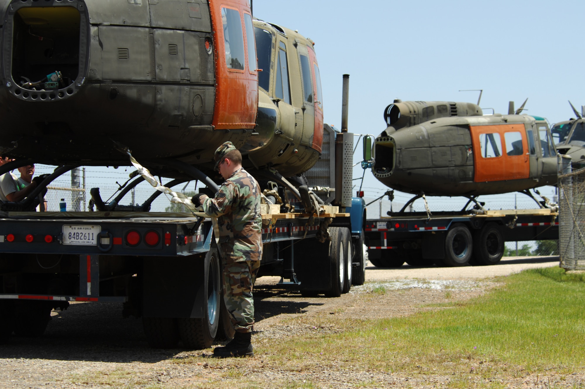 FT. RUCKER, Al. - Final checks are made as members from the 23rd Logistics Readiness Squadron, prepare to transport decomissioned UH-1 Huey helicopter fuselages April 30. Five UH-1 helicopter fuselages are being transported by truck to  be used to enhance Moody's combat search and reascue readiness. (U.S. Air Force photo by Staff Sgt. Joshua T Jasper) 