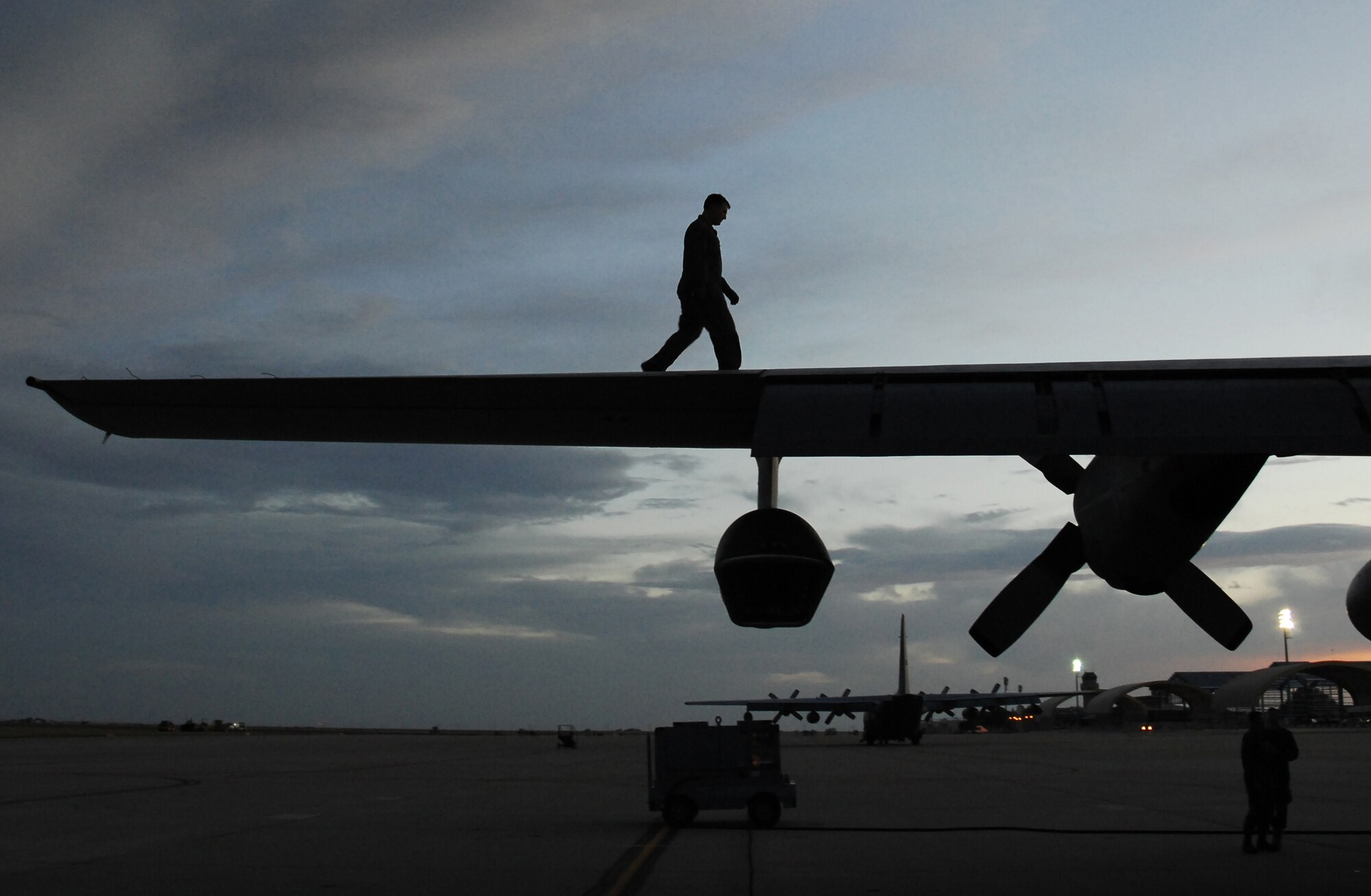 CANNON AIR FORCE BASE, N.M.-- Tech. Sgt. Brian Hoffner, 73rd Special Operations Squadron, performs a pre-flight inspection on an MC-130W Combat Spear prior to taking off for a night flying exercise April 29.  The MC-130W performs missions primarily at night to reduce operational risk. (U.S. Air Force photo/Airman 1st Class Liliana Moreno)  