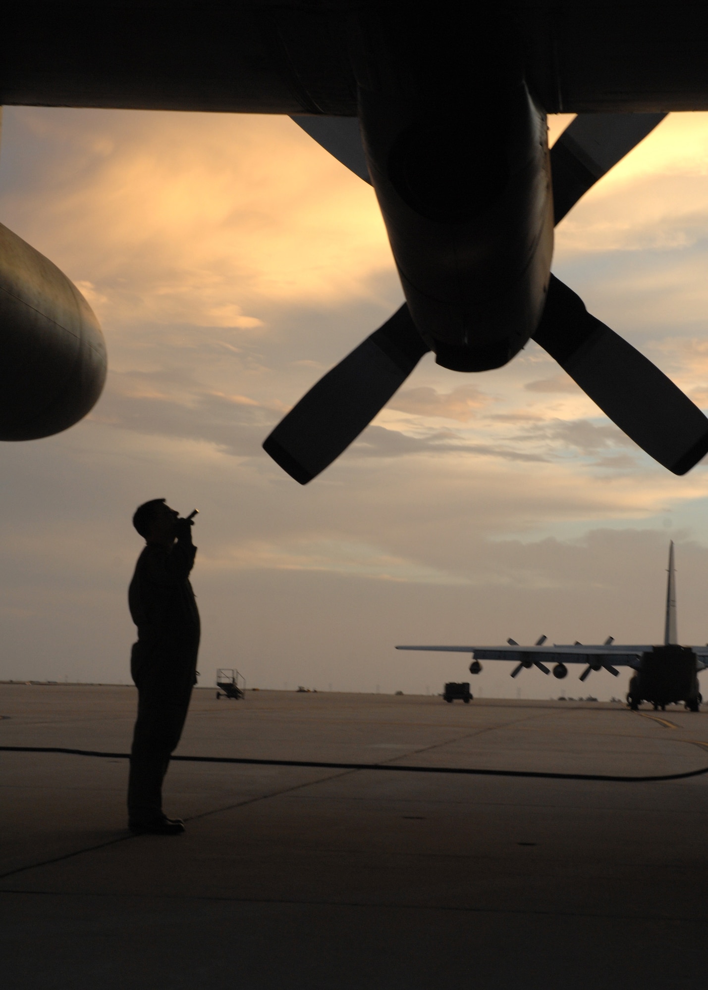 CANNON AIR FORCE BASE, N.M.-- Tech. Sgt. Brian Hoffner, 73rd Special Operations Squadron, inspects a MC-130W in preparation of a night flying exercise April 30. The MC-130W performs missions primarily at night to reduce operational risk. (U.S. Air Force photo/Airman 1st Class Evelyn Chavez)