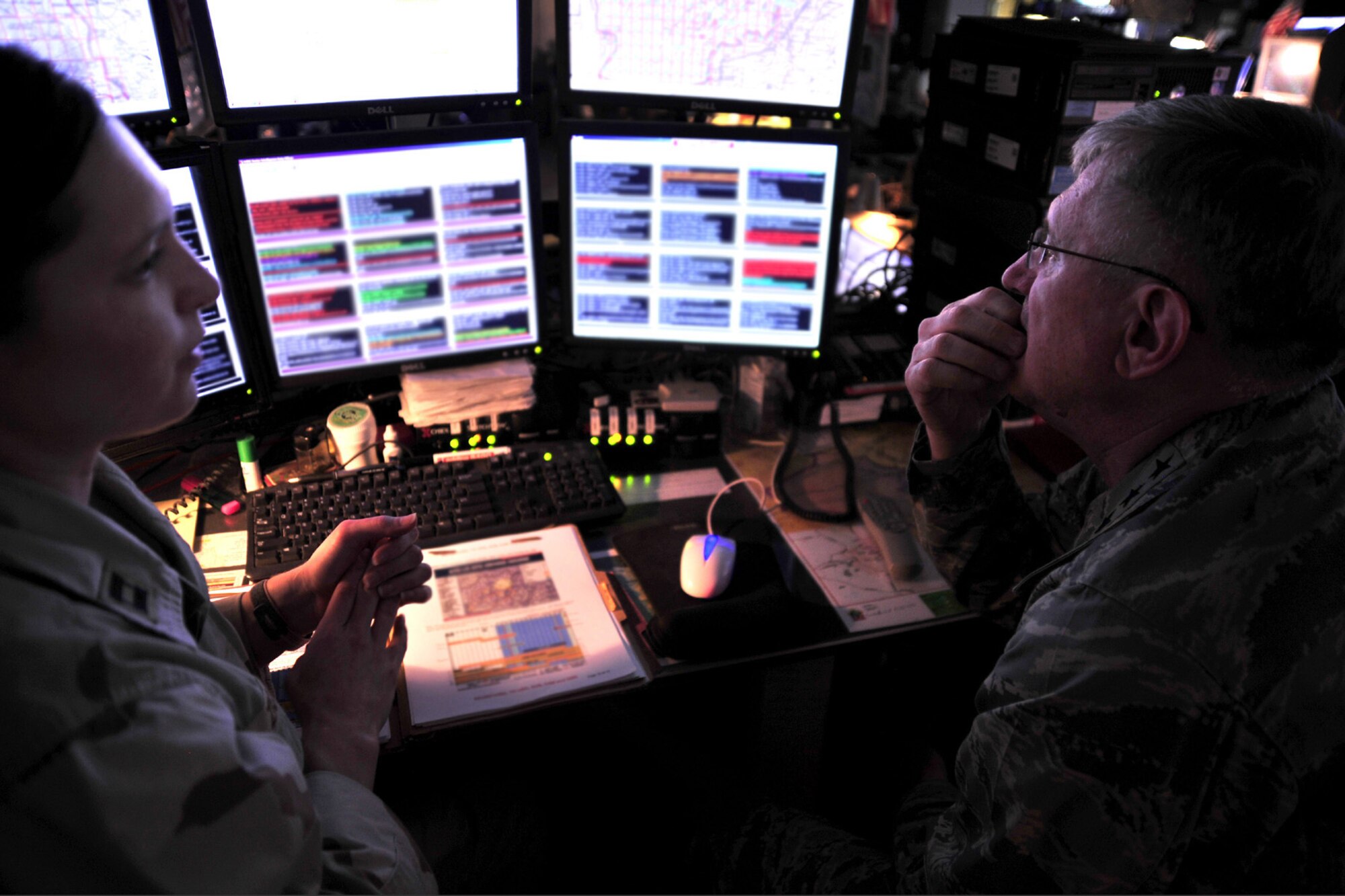 Capt. Connie Zicaro, Senior Intelligence duty officer, briefs Gen. Roger Brady, U.S. Air Forces in Europe commander, about daily aircraft operations at the Combined Air and Space Operations Center in Southwest Asia April 29. General Brady visited the CAOC on his way to other bases in the area of responsibility to meet with deployed Airmen from USAFE. (U.S. Air Force Photo by: Staff Sgt. Christina M. Styer) (RELEASED)*
