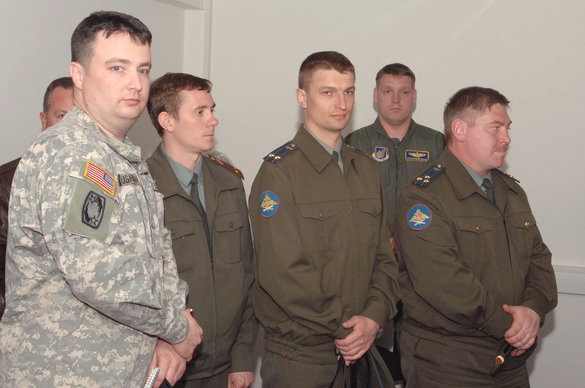 Sgt. 1st Class Russel Cushman translated both a briefing and questions during Lt. Col. Dennis Kondrashkin, Lt. Col. Sergey Izkenekov, and Col. Aleksandu Razygraeu’s visit to the Joint Fighter's Center for Excellence at Spangdahlem AB, Germany, April 30, 2008. (United States Air Force Photo by Senior Airman Logan Tuttle)