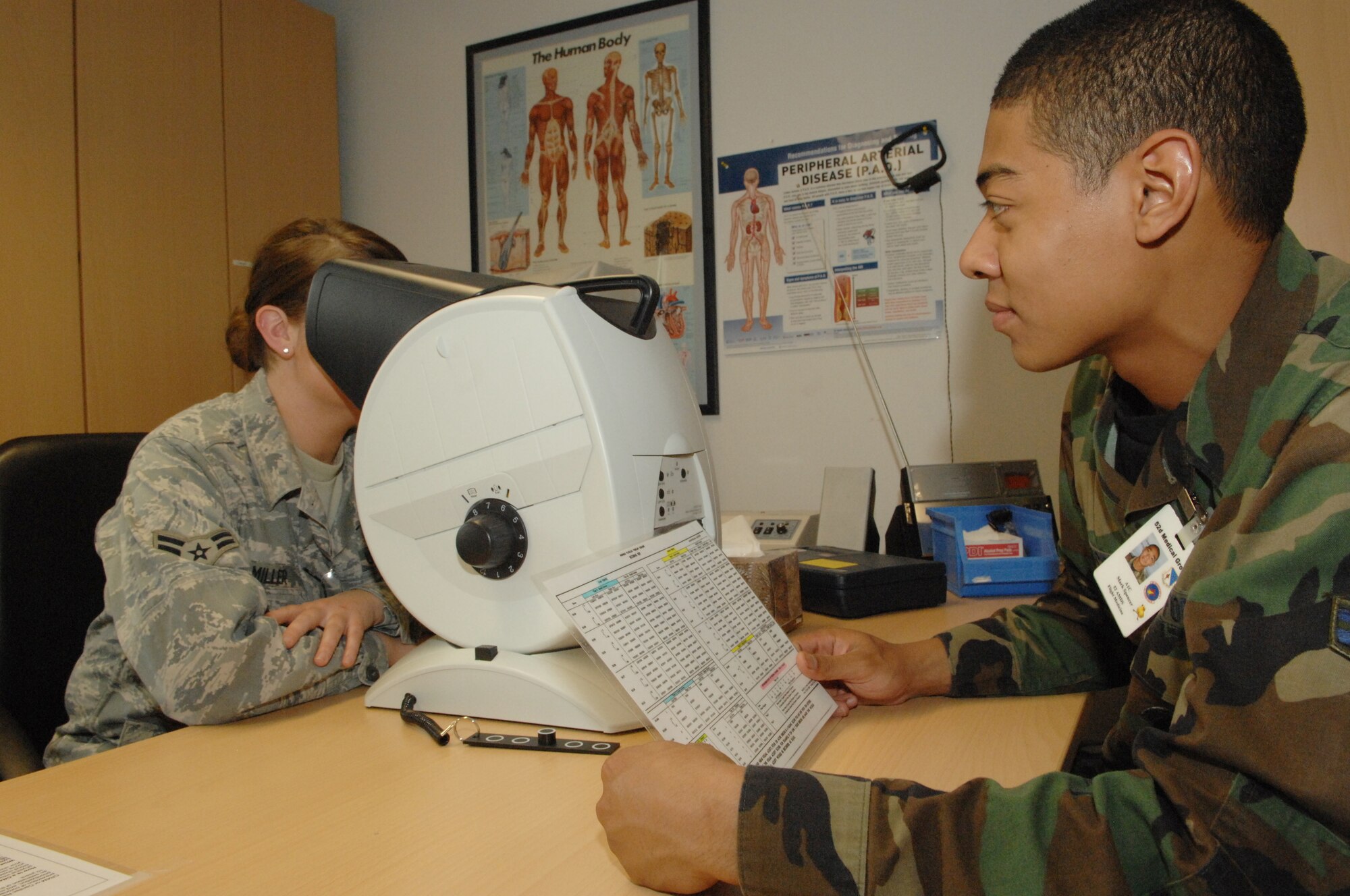SPANGDAHLEM AIR BASE, Germany -- Airman 1st Class Mark Spencer, 52nd Aerospace Medicine Squadron, performs a vision test during nurse’s appreciation week April 30, 2008.  Nurses appreciation week was a week designed to recognize the efforts of the nurses and technicians that work here.  (U.S. Air Force photo by Senior Airman Logan Tuttle)