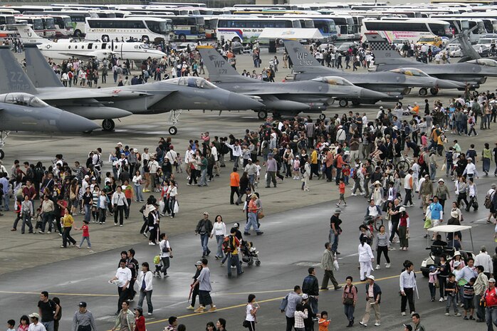 Visitors tour the Japanese and American aircraft on display at the Marine Corps Air Station Iwakuni apron line during Friendship Day 2008 Monday. Despite the overcast morning, the annual open house and air show drew more than 93,000 attendees before noon.