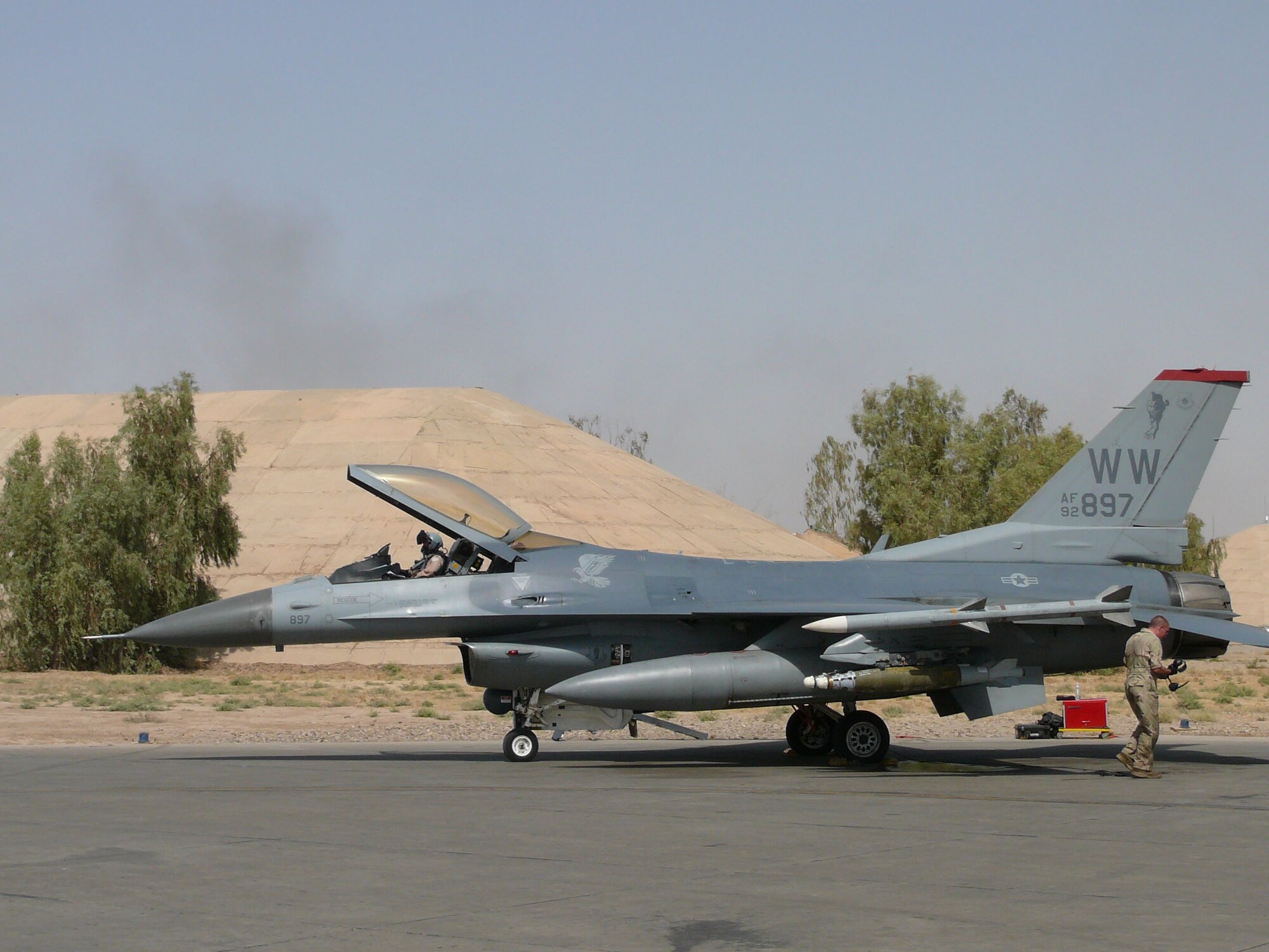 A 13th Expeditionary Fighter Squadron pilot and crew chief prepares a jet for launch at Balad Air Base, Iraq. (Courtesy photo)