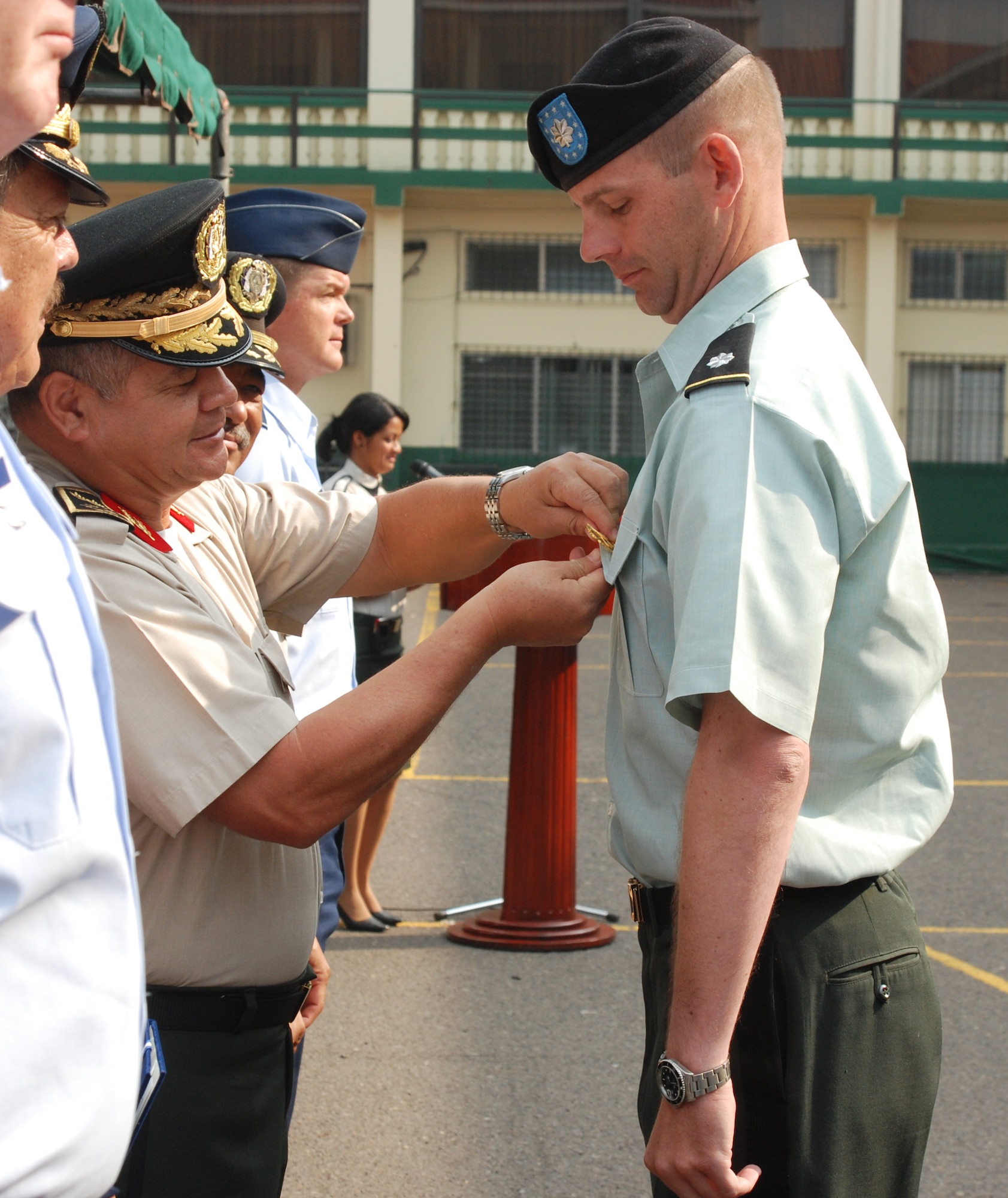 Army Lt. Col. Gregory Jicha receives the Honduran Medal of Merit First Class from Honduran Chief of Defense, General de Division Romeo Orlando Vasquez Velasquez, during a ceremony May 5 in Tegucigalpa Honduras. Colonel Jicha is the Joint Task Force-Bravo Army Forces commander at Soto Cano Air Base, Honduras. (U.S. Air Force photo/Tech. Sgt. John Asselin)