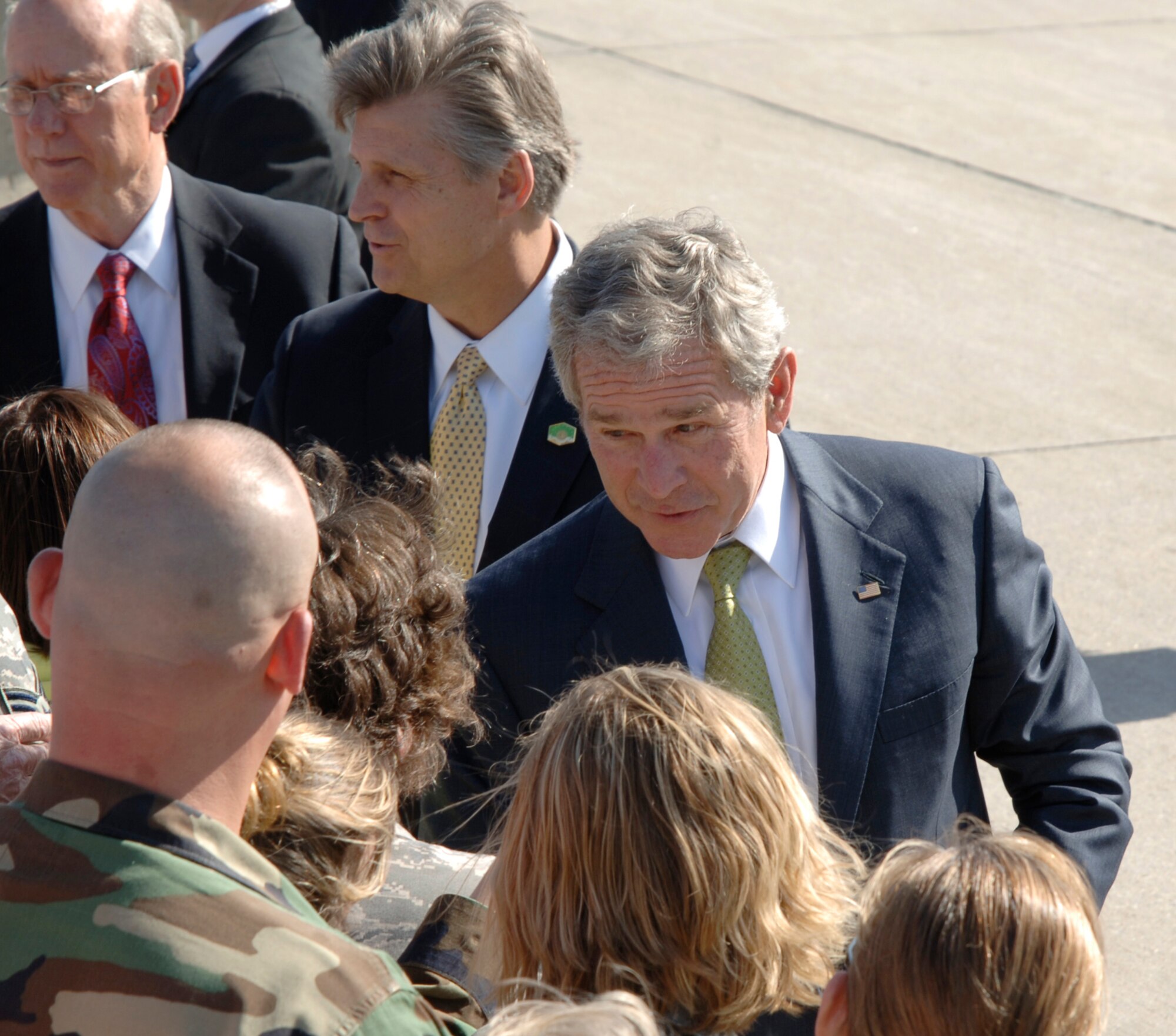 MCCONNELL AIR FORCE BASE, Kan. -- President George W. Bush takes a minute to to shake the hand of a McConnell youth before he departs Kansas on Air Force One, May 4. The president transitioned through McConnell to Greensburg to give a commencement speech to 18 high school graduates, despite their struggles from a F-5 tornado that devastated the town in May 2007.  (Photo by Senior Airman Roy Lynch)