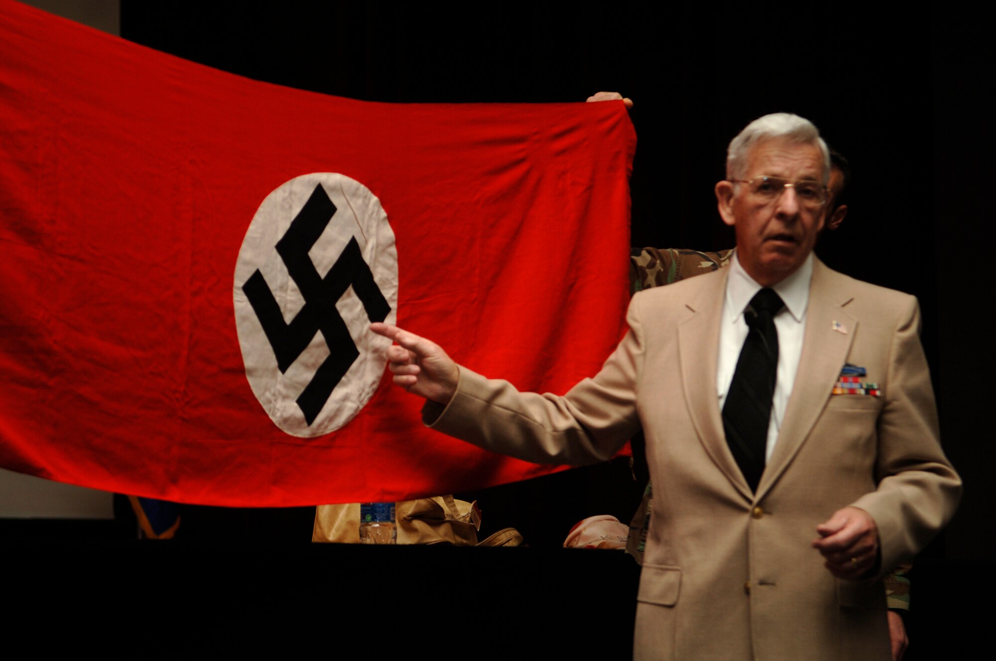 FAIRCHILD AIR FORCE BASE, Wash. – Leo Hymas speaks of the atrocities he witnessed at Buchenwald, a Nazi concentration camp. Hymas was a member of the Army team that liberated the camp in April 1945. “On May 7 we celebrate(d) 53 years of the unconditional surrender of Germany. I was there,” he said. (U.S. Air Force photo / Staff Sgt. Chad Watkins)