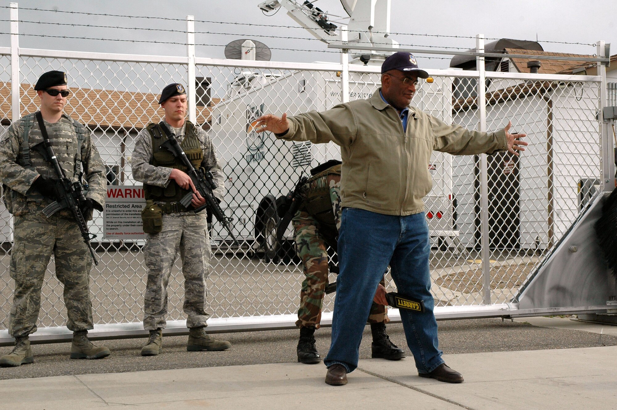 Al Roker, NBC's Today Show co-host, gets searched by a security controller before entering a missile alert facility May 5 near Malmstrom Air Force Base, Mont.  Mr. Roker was preparing to broadcast live from the area May 6 as part of their "Access Granted" series, which puts cameras in high-security places.  (U.S. Air Force photo/Senior Airman Eydie Sakura)