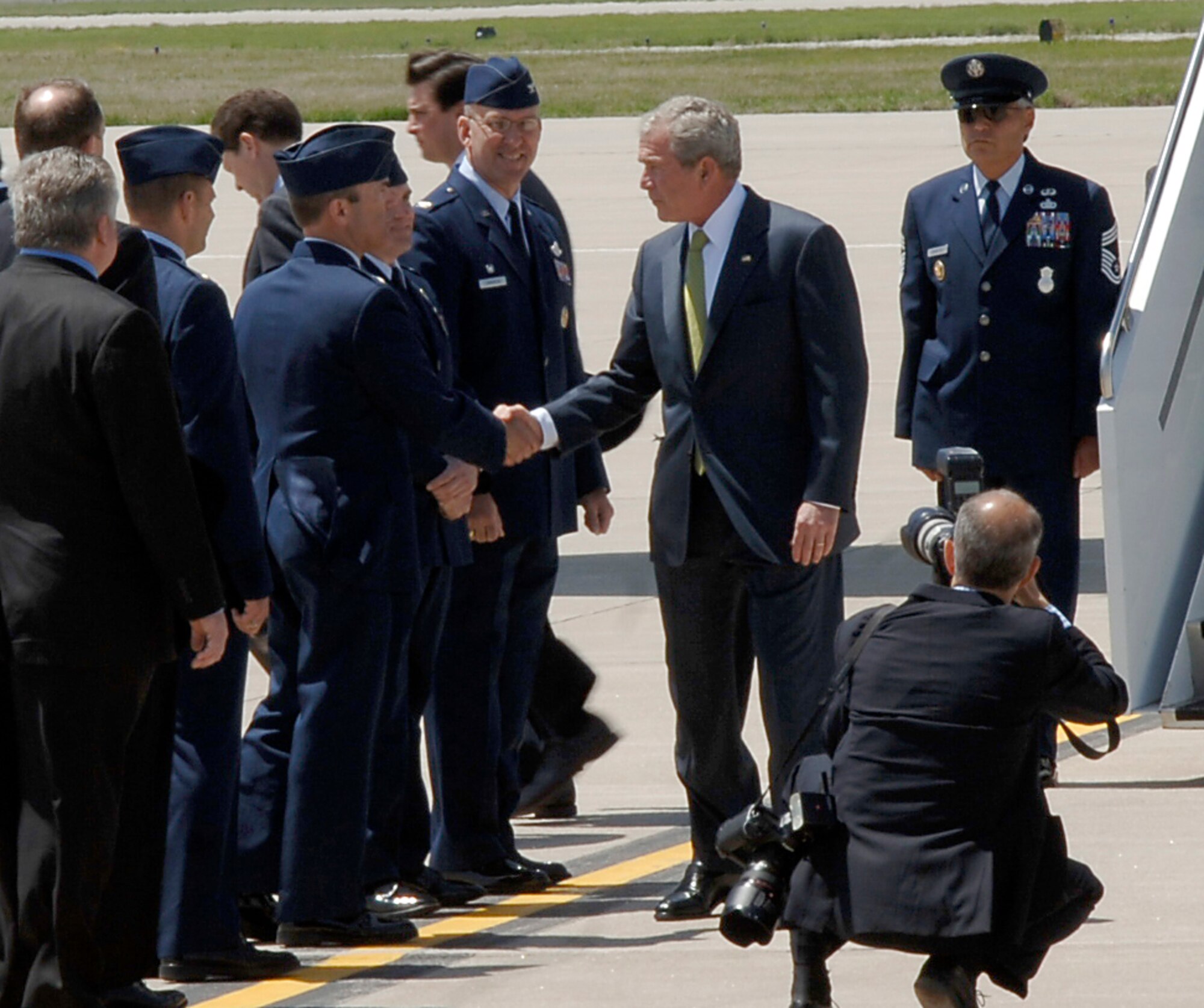 Col. William Cahoon, 931st Air Refueling Group Commander, greets President George Bush at McConnell Air Force Base, Kan., on May 4.  The president was in Kansas to visit Greensburg, Kan., a town west of McConnell AFB that was destroyed by a tornado a year prior. Airmen from throughout the 931st also greeted the president, who took time to shake many of their hands.