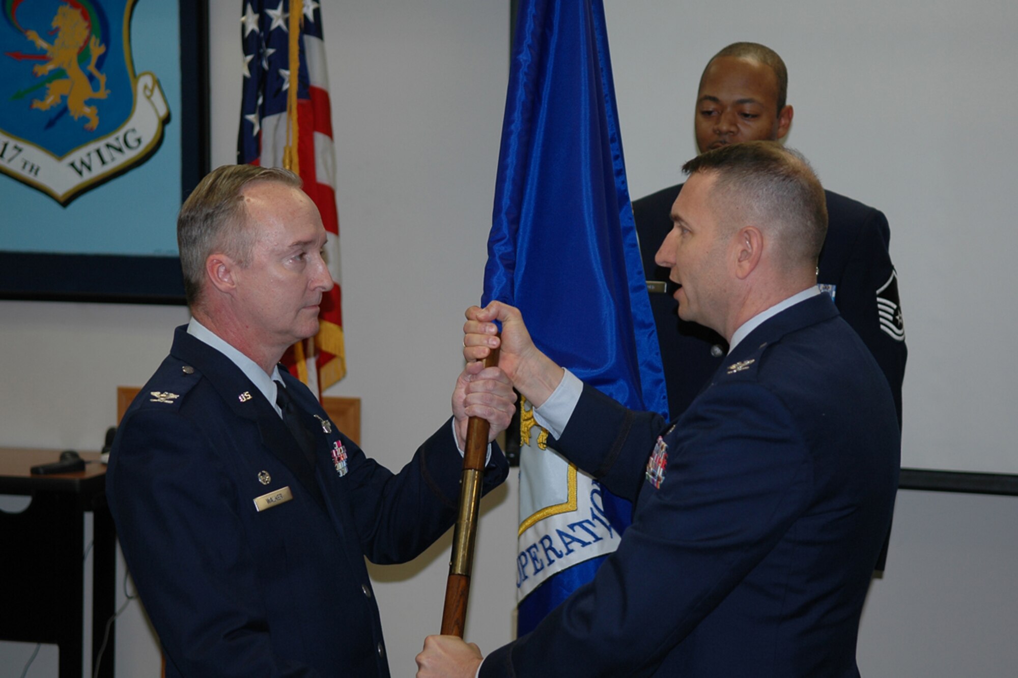 Col. Edmund D. Walker, wing commander, accepts the 917th Operations Group flag from Col. Ozzie H. Gorbitz during the change of command cermomy at the wing auditorium, Sunday, May 4, 2008. Col. Gorbitz, leaves the wing to assume a position at Tenth Air Force. Lt. Col. Robert J. Nordberg ll assumed command of the group. (US Air Force photo/Tech. Sgt. Jeffrey S. Walston) 