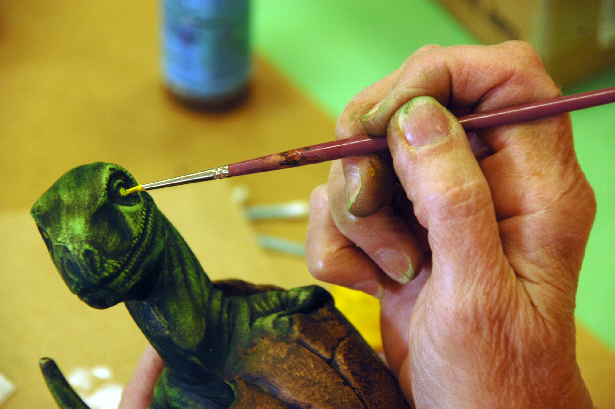 HOLLOMAN AIR FORCE BASE, N.M.--Jo Abell adds details to a ceramic piece at the Arts and Crafts Center here. Once finished, the pieces will serve as award presentations. (U.S. Air Force photo/Airman 1st Class Jamal D. Sutter)