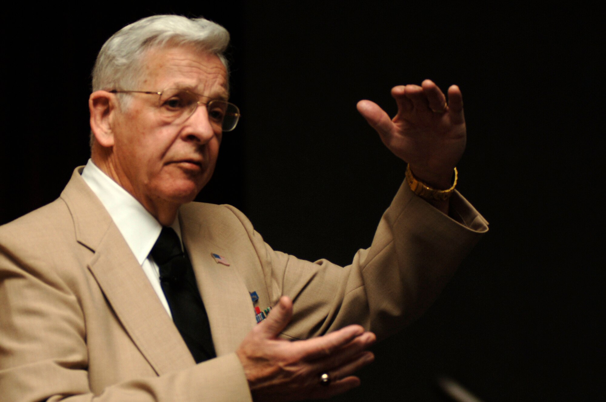 FAIRCHILD AIR FORCE BASE, Wash. – Leo Hymas speaks at a Holocaust Remembrance ceremony here May 2 of his time in the Army. Mr. Hymas was a member of the Army team that liberated the Nazi concentration camp Buchenwald in April 1945. At the time of the liberation, the slave-labor camp held prisoners of more than 50 nationalities. One of those end-of-war prisoners was Nobel Prize-winning author and political activist Eli Wiesel. (U.S. Air Force photo / Staff Sgt. Chad Watkins)