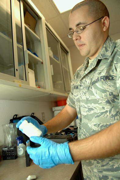 HOLLOMAN AIR FORCE BASE, N.M. -- Airman 1st Class Nicholas Martin, a 49th Aeromedical Dental Squadron bioenvironmental engineering technician, tests drinking water at the medical clinic here May 5. The bioenvironmental engineering flight is required to test Holloman?s drinking water three to four times per week. (U.S. Air Force photo by Airman Sondra M. Wieseler)