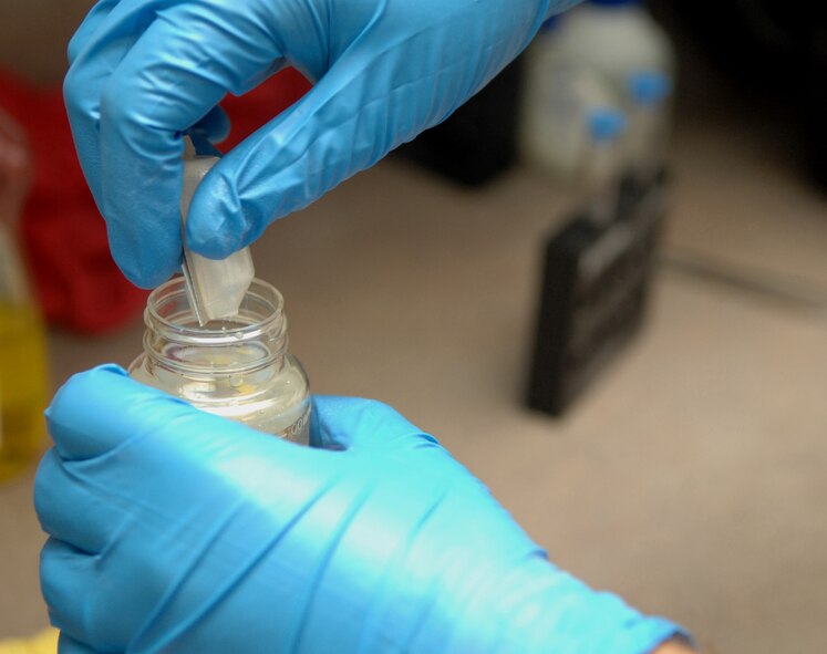 HOLLOMAN AIR FORCE BASE, N.M. -- Airman 1st Class Nicholas Martin, a 49th Aeromedical Dental Squadron bioenvironmental engineering technician, tests drinking water at the medical clinic here May 5. He pours Colilert into the water to test for coliform bacteria and Escherichia coli (E. coli) in the water. (U.S. Air Force photo by Airman Sondra M. Wieseler)