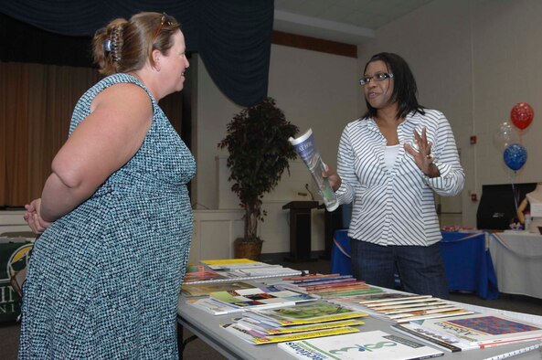SHAW AIR FORCE BASE, S.C.-- Andread Mayers (right) stops at the Homeward Education Association booth to speak with Rachel Ward at the Pre-Deployment Fair May 2. The Pre-Deployment Fair raises awareness for active duty personnel and their families on what to expect during a deployment. (U.S. Air Force photo/Airman 1st Class Mathew Davis)