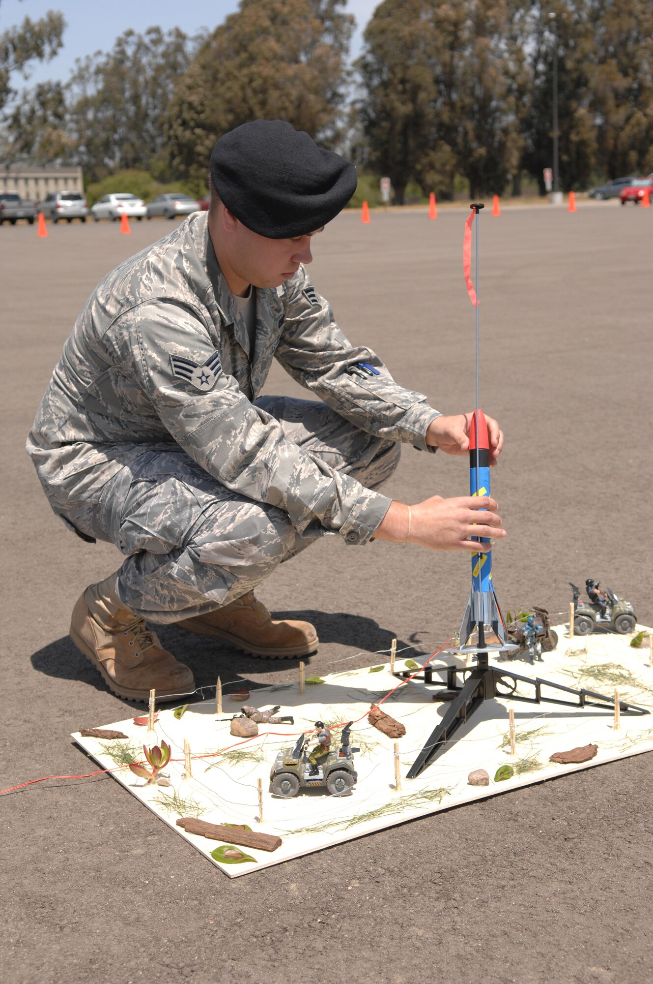 VANDENBERG AIR FORCE BASE Calif.--- Senior Airman Zachary Regan, 30th Security Forces Squadron, prepares his squadron's rocket for take-off at the Guardian Challenge Rocket Competition on Friday.  The competition was open to all personnel on base to enter and awarded a prize to the rocket that came closest to hitting the designated target. (U.S Air Force Photo/Airman 1st Class Nicole Roberts)