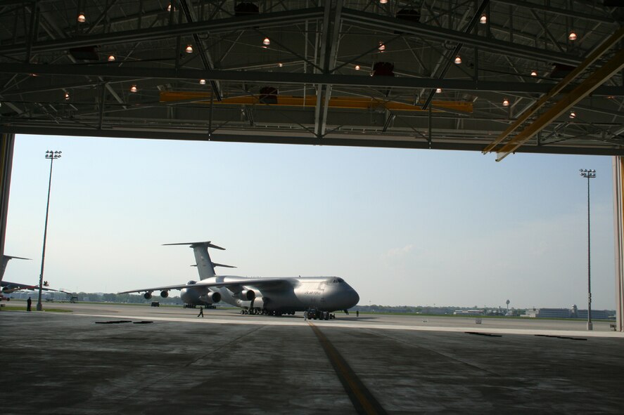 WRIGHT-PATTERSON AFB, Ohio - A C-5 Galaxy taxies into position for a fit test into the third and final hangar to be completed as part of the 445th Airlift Wing's large construction project to support the C-5 aircraft since their conversion began.  This hangar includes staff, shops, and tool crib areas used primarily for scheduled maintenance. (U.S. Air Force photo/Mary Allen)   