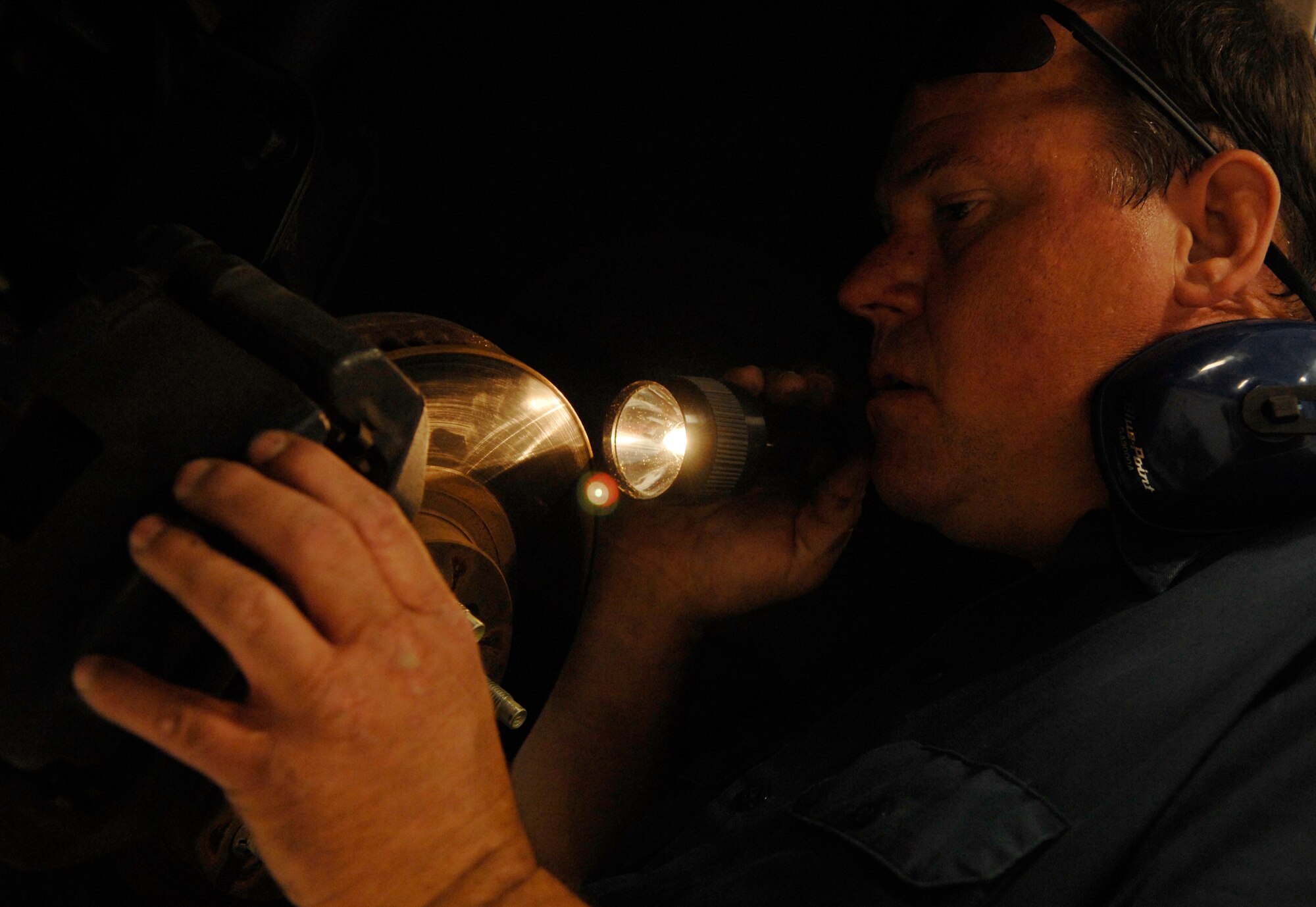 MOODY AIR FORCE BASE, Ga. -- John Butler, 23rd Logistics Readiness Squadron heavy mobile mechanic, inspects brakes on a vehicle here May 6. Government owned vehicles are brought in routinely for preventative maintenance. (U.S. Air Force photo by Senior Airman Gina Chiaverotti)