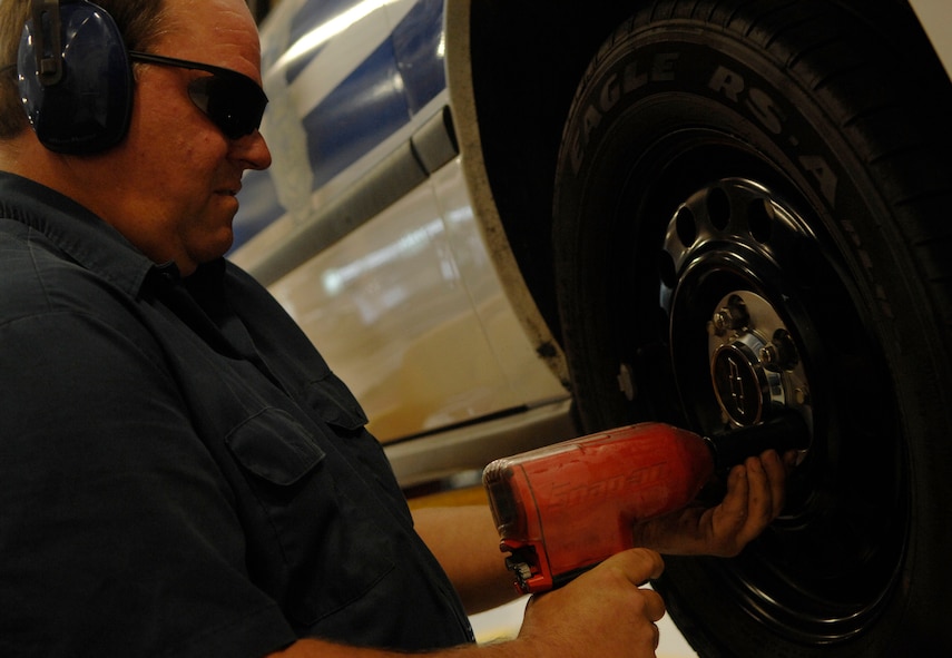 MOODY AIR FORCE BASE, Ga. --  John Butler, 23rd Logistics Readiness Squadron heavy mobile mechanic, removes a tire's lug nuts here May 6. Mr. Butler is preparing to inspect the vehicle's brakes. (U.S. Air Force photo by Senior Airman Gina Chiaverotti)