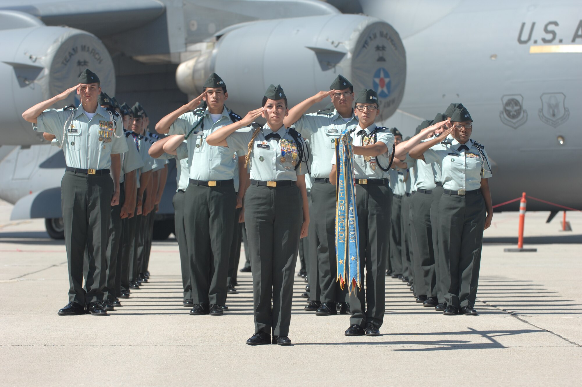An Army Junior ROTC unit from the local area presents arms during the playing of the National Anthem on the flight line at March Air Reserve Base.  Some 400 cadets from various Southern California schools participated in the event.  (U.S. Air Force photos by Senior Airman Daniel St. Pierre, 4th Combat Camera Squadron)