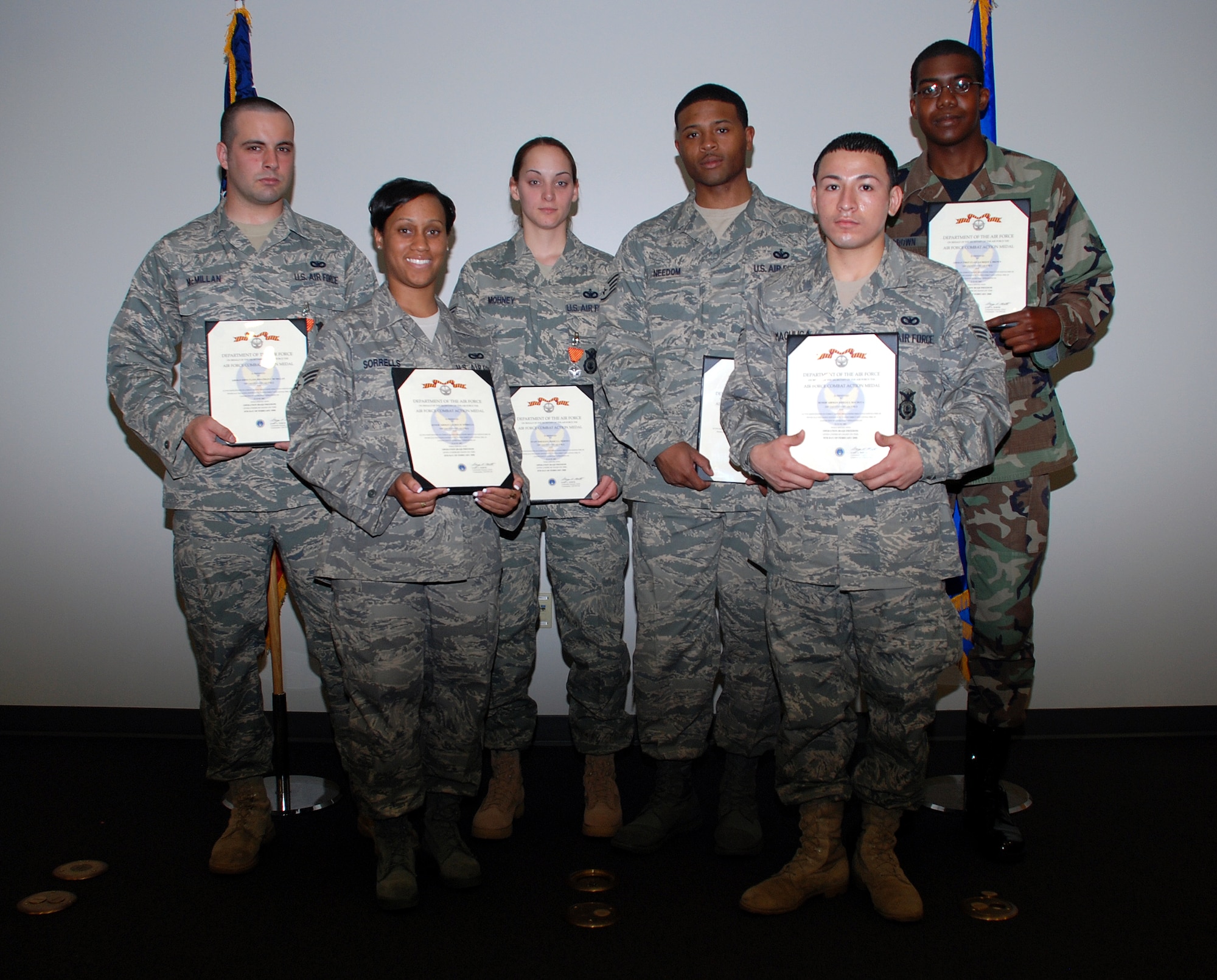 Six 305th Security Forces Squadron Airmen here were recently presented with Air Force Combat Action Medals for their heroic actions while deployed in support of Operation Iraqi Freedom. The AFCAM was created in recognition of Airmen taking on increasingly dangerous roles in Iraq and Afghanistan, where they perform missions, including ground combat, alongside Soldiers and Marines. (U.S. Air Force photo/Airman 1st Class Rebekah Phy)