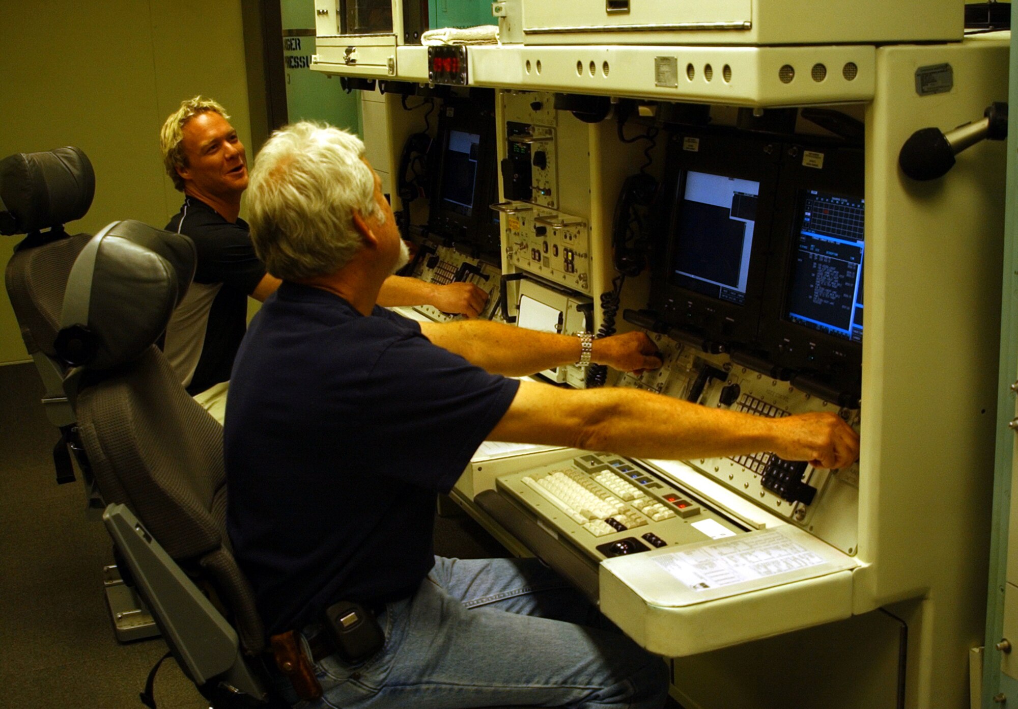 MALMSTROM AIR FORCE BASE, Mont. – NBC's Today Show videographer Nelson Tharp, right, and video technician Corey Leibin, left, take a turn at the console  inside the missile procedures trainer here May 3. The film crew was in town preparing for a live broadcast May 6 featuring co-host Al Roker and various Malmstrom Airmen. (U.S. Air Force photo/Airman 1st Class Dillon White)                                                                