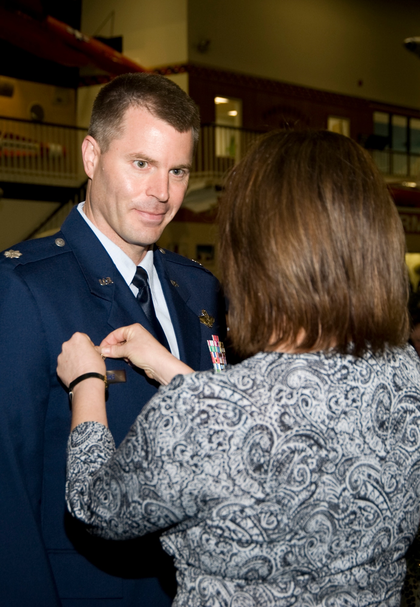 Lt. Col. Gregory Patschke receives his commander's pin from his wife Kathy after assuming command of the 36th Electronic Warfare Squadron during a ceremony at the Air Armanent Center May 2 at Eglin Air Force Base, Fla.  He took the reins from Lt. Col. John "Hap" Arnold.  The 36th EWS is part of the 53d Electronic Warfare Group.  U.S. Air Force photo.