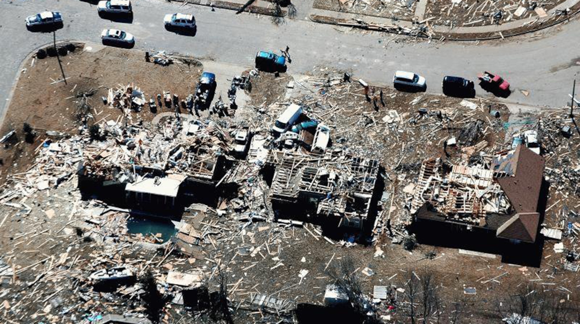 An aerial view of the tornado’s aftermath shows the Glover’s house, far left, demolished, along with those of their neighbors. (Courtesy of the Civil Air Patrol)