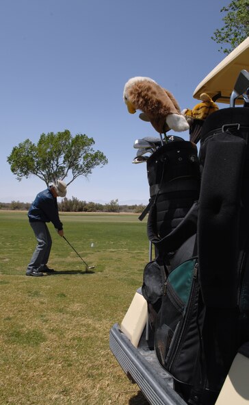 HOLLOMAN AIR FORCE BASE, N.M. -- Dwight Harp, a member of Alamogordo Chamber of Commerce?s Committee of 50 and Holloman wingman, tees off at the Apache Mesa Golf Course here April 25. Forty-four people participated in the tournament where Team Holloman competed against the Committee of 50. (U.S. Air Force photo/Airman Sondra Wieseler)