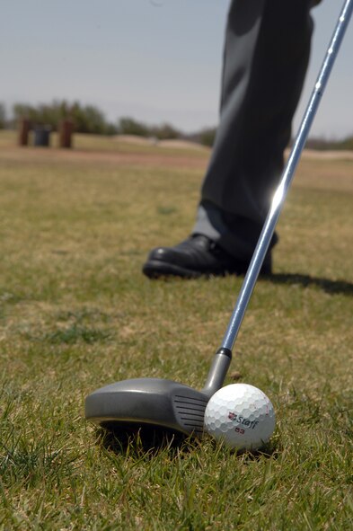 HOLLOMAN AIR FORCE BASE, N.M. -- Dwight Harp, a member of  the Alamogordo Chamber of Commerce?s Committee of 50 and Holloman wingman, prepares to tee off at the Apache Mesa Golf Course here April 25. Team Holloman won the tournament against the Committee of 50, 14 and a half to 18 and a half. (U.S. Air Force photo/Airman Sondra Wieseler)