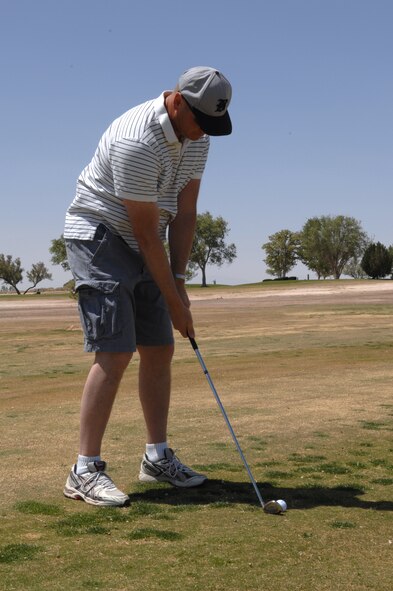 HOLLOMAN AIR FORCE BASE, N.M. -- Chief Master Sgt. Richard Sheridan, 49th Materiel Maintenance Squadron, prepares to tee off on the first hole of the Committee of 50 Golf Tournament at the Apache Mesa Golf Course here April 25. Members of Alamogordo Chamber of Commerce?s Committee of 50, members of Team Holloman and other invited guests competed in the two-man scramble competition. (U.S. Air Force photo/Airman Sondra Wieseler)