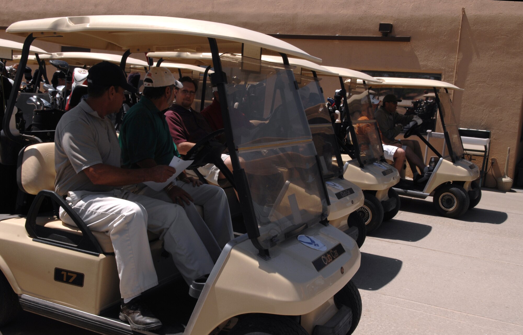 HOLLOMAN AIR FORCE BASE, N.M. -- Members of the Alamogordo Chamber of Commerce?s Committee of 50, along with members of Team Holloman and other invited guests, prepare to begin the Committee of 50 Golf Tournament at the Apache Mesa Golf Course here April 25. The Committee of 50 holds golf tournaments twice a year, one of which is hosted on base and is played against Team Holloman. (U.S. Air Force photo/Airman Sondra Wieseler)