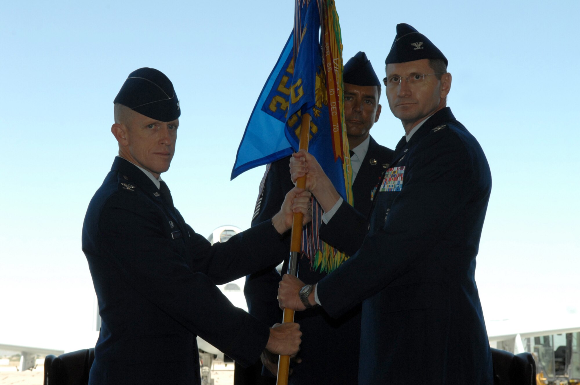 Col. Charles R. Hunter (right) receives the 355th Mission Support Group guidon from the 355th Fighter Wing Commander Col. Kent Laughbaum during a change-of-command ceremony here May 2.  Colonel Hunter assumes command after serving as the A4/7 Director of Logistics and Installations for 12th Air Force and Air Forces Southern and as the Commander of the 612th Air Support Squadron here. (U.S. Air Force photo by Airman 1st Class Noah R. Johnson)