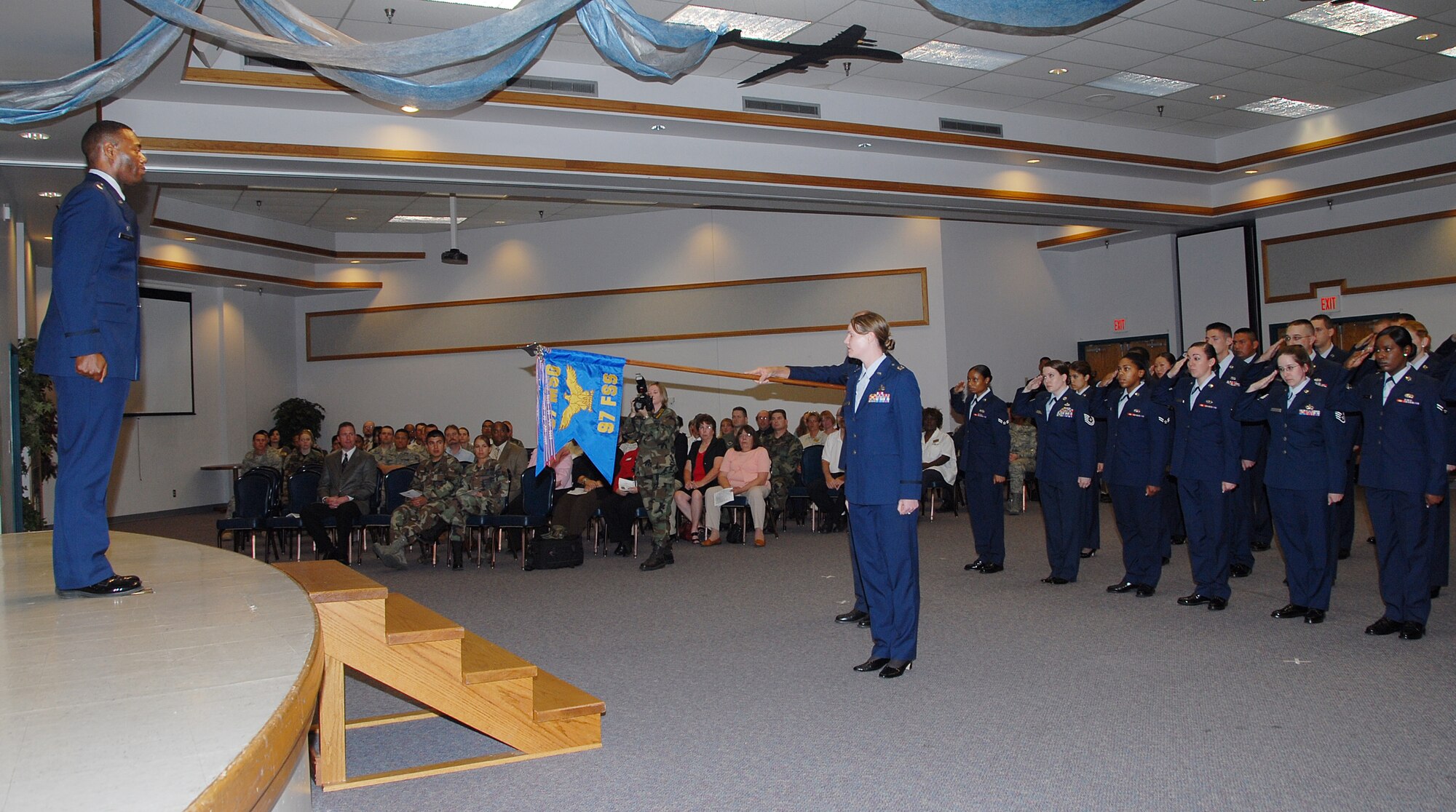 The newly formed 97th Forces Support Squadron renders its first salute to Lt. Col. Henry L. Moton, first commander of the 97th FSS. The 97th Mission Support Squadron and 97th Services Squadron merged into the 97th FSS during a ceremony on Altus AFB, May 5. (U.S. Air Force/A1C Cherice Bryant)