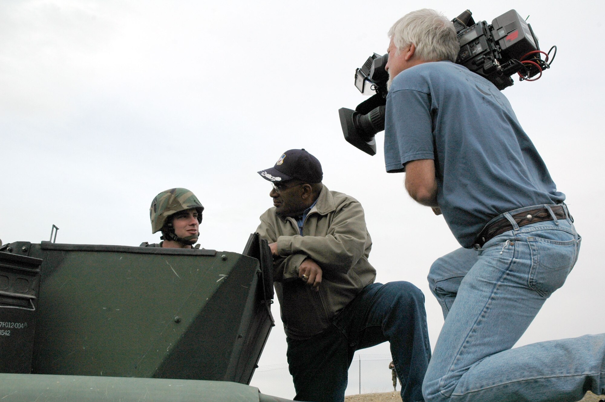 Al Roker, NBC’s Today Show co-host, interviews Airman 1st Class David Blais, 341st Missile Security Forces mobile fire teams member, on top of a HUMVEE with his MK-19 automatic, rapid firing grenade launcher near a missile alert facility near Malmstrom Air Force Base, Mont., May 5.  (U.S. Air Force photo/Senior Airman Eydie Sakura)
