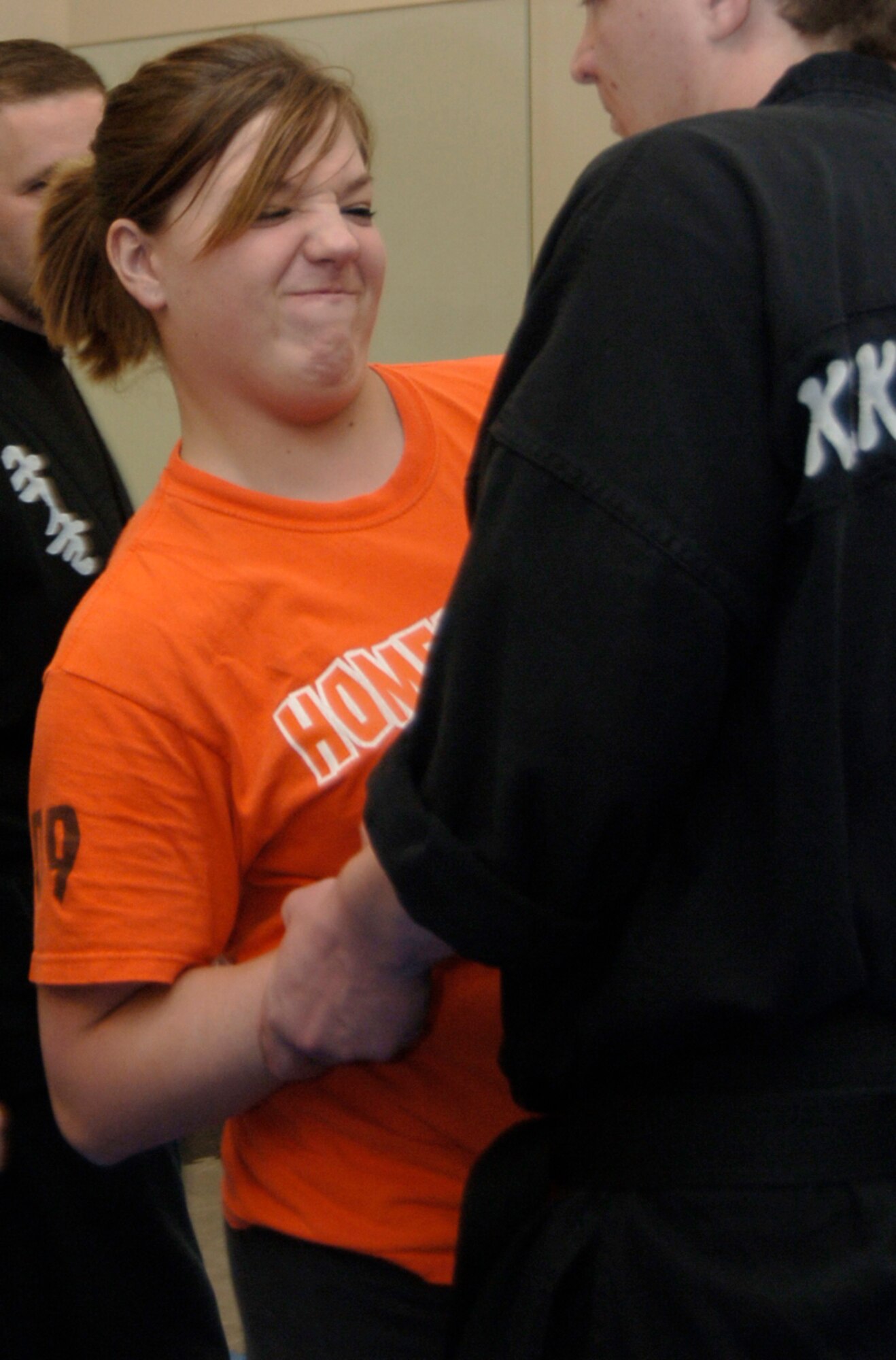 MOUNTAIN HOME AIR FORCE BASE, Idaho -- (Left) Jenna Thompson tries to escape from Brian Dalpez, a Kuk Sool Won martial arts students, during a self-defense class at the base fitness center April 29. The classes, which were held throughout April for adults and on April 29 for teenagers, were sponsored by the base's sexual assault response coordinator, or SARC, office and were part of the base's sexual assault awareness month. (U.S. Air Force photo/Airman 1st Class Samantha S. Crane)