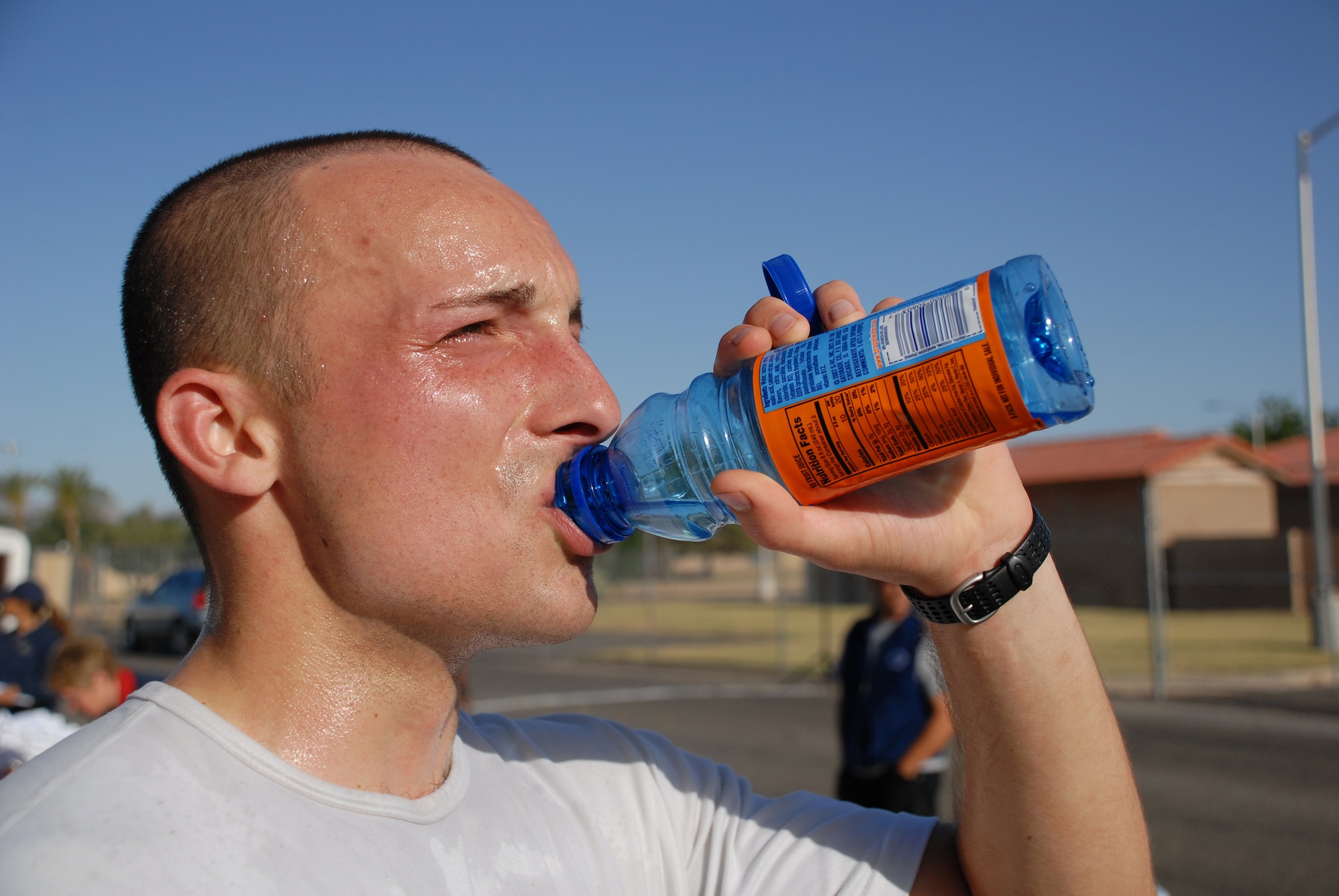 Airman 1st Class Michael Piazza, an air traffic controller with the 56th Operations Support Squadron, hydrates after completing the 13.2 mile marathon held at the Base Fitness Center, May 3. The half marathon consisted of more than 50 Airmen, retirees, and children from Luke Air Force Base. (U.S. Air Force photo/Airman 1st Class Tracie Forte)