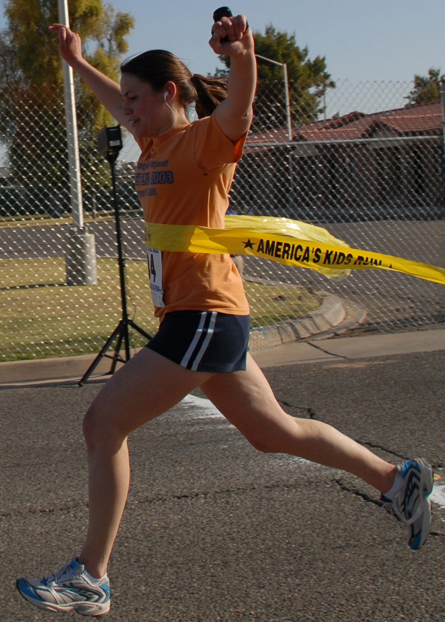 Second Lieutenant Sarah Hall, deputy chief of intel operations with the 56th Operations Support Squadron, crosses the finish line after 1 hour 58 minutes, becoming the first woman to finish the 13.2 mile run held at the Base Fitness Center, May 3. Lt. Hall is her squadrons physical training leader and also runs 4 to 5 miles at least 3 times a week. The half marathon consisted more than 50 Airmen, retirees, and children from Luke Air Force Base. (U.S. Air Force photo/Airman 1st Class Tracie Forte)