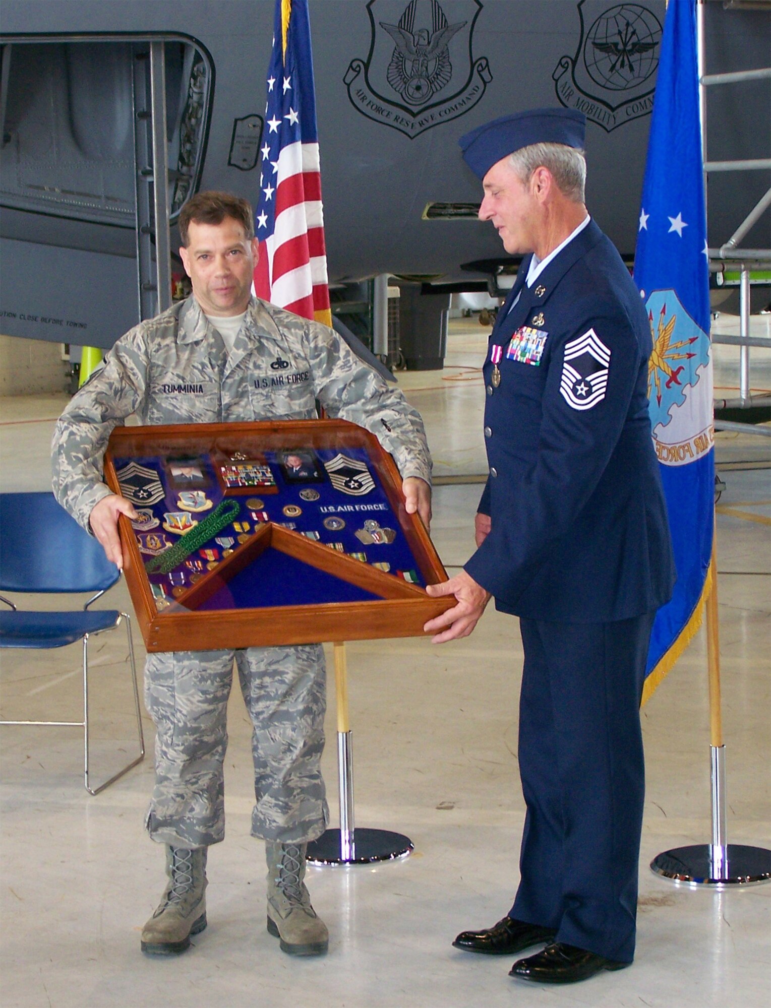 SEYMOUR JOHNSON AIR FORCE BASE, N.C. -- Chief Master Sgt. Terry Eddy (right) is presented with his career shadow box during his retirement ceremony on May 4. Chief Eddy served as the chief enlisted manager for the 916th Maintenance Group. He retired with more than 38 years of military service.