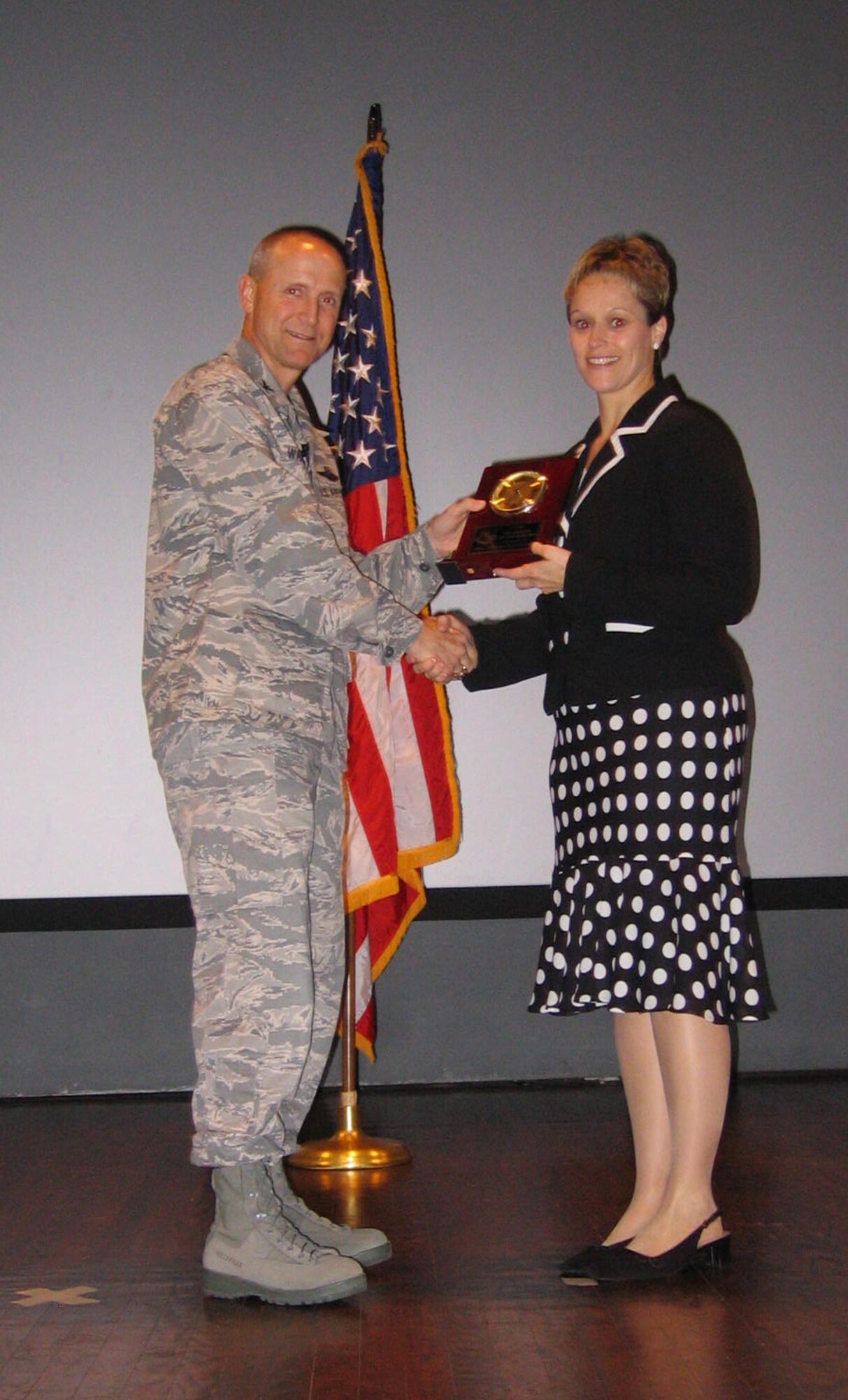 SEYMOUR JOHNSON AIR FORCE BASE, N.C. -- Capt. Shelley LeVan (right) receives the 4th Fighter Wing Mission Support Group Civilian of the Year award for first quarter 2008. Capt. LeVan works full-time for the 4th Fighter Wing in communications and is a traditional Reservist with the 916th Air Refueling Wing. During her Reserve weekends she is the chief of the Equal Opportunity office.