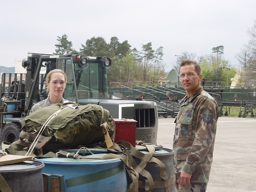 Staff Sgt. Catherine Fitzpatrick, 86th Maintenance Squadron unit deployment manager, oversees a pallet build up at the Joint Mobility Processing Center with Master Sgt. Wolfgang Seng, 86th Maintenance Group deployment superintendent."(Courtesy Photo)