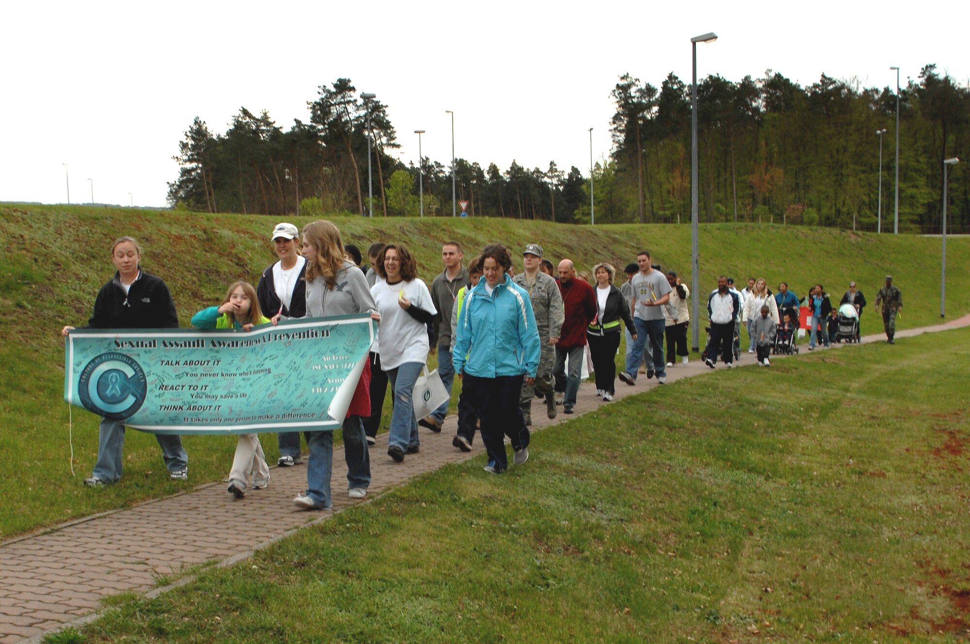 Air Force and Army members along with civilians, participate in the Shine the Light walk on Ramstein April 30. Shine the Light was a mile and a half walk in honor of sexual assault victims, and to help spread awareness. (United States Air Force photo by Airman First Class Heidi Holston)(RELEASED)

