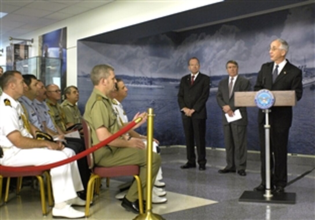 Deputy Secretary of Defense Gordon England, right, addresses an international audience during the May 6, 2008, dedication ceremony for the Pentagon's newly redesigned corridor themed to honor the security treaty among Australia, New Zealand and the United States known as ANZUS. Although the formal treaty among the nations was signed in 1951, military cooperation between the three partners extends back to well before World War I. 