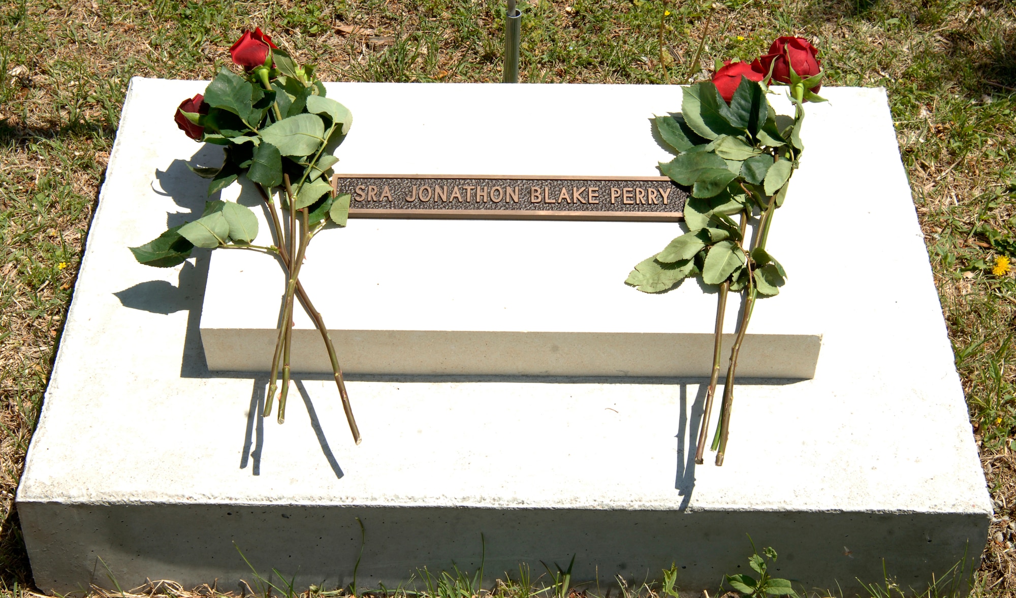 MCCONNELL AIR FORCE BASE, Kan. -- A memorial stone is dedicated to the late Senior Airman Jonathan Blake Perry, 22nd Aircraft Maintenance Squadron, communication and navigation systems specialist, at the Memorial Walk, May 4. Memorial stones are dedicated to deceased Team McConnell members for their dedication and service to the base and the Air Force. (Photo by Airman Justin Shelton)