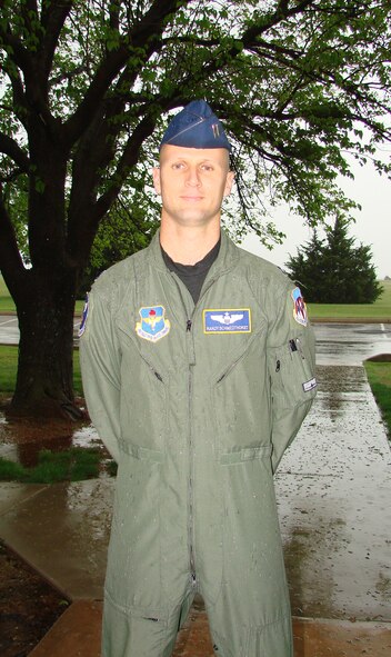 Capt. Randall Schmedhorst, instructor pilot with the 3rd Fighter Training Squadron, changed station from Hill Air Force Base, Utah. to Vance AFB, Okla. in February, making a trip he planned to visit family and run the eighth annual Oklahoma City Memorial Half Marathon much shorter. Six thirty a.m., Apr. 27, Captain Schmedhorst, wearing garbage bags atop his running gear against heavy rain and wind, was running under a seven minute mile with wet shoes. Captain Schmedhorst finished 37th overall out of 4,355 participants. (U.S. Air Force photo by 2nd Lt. Agneta Murnan)
