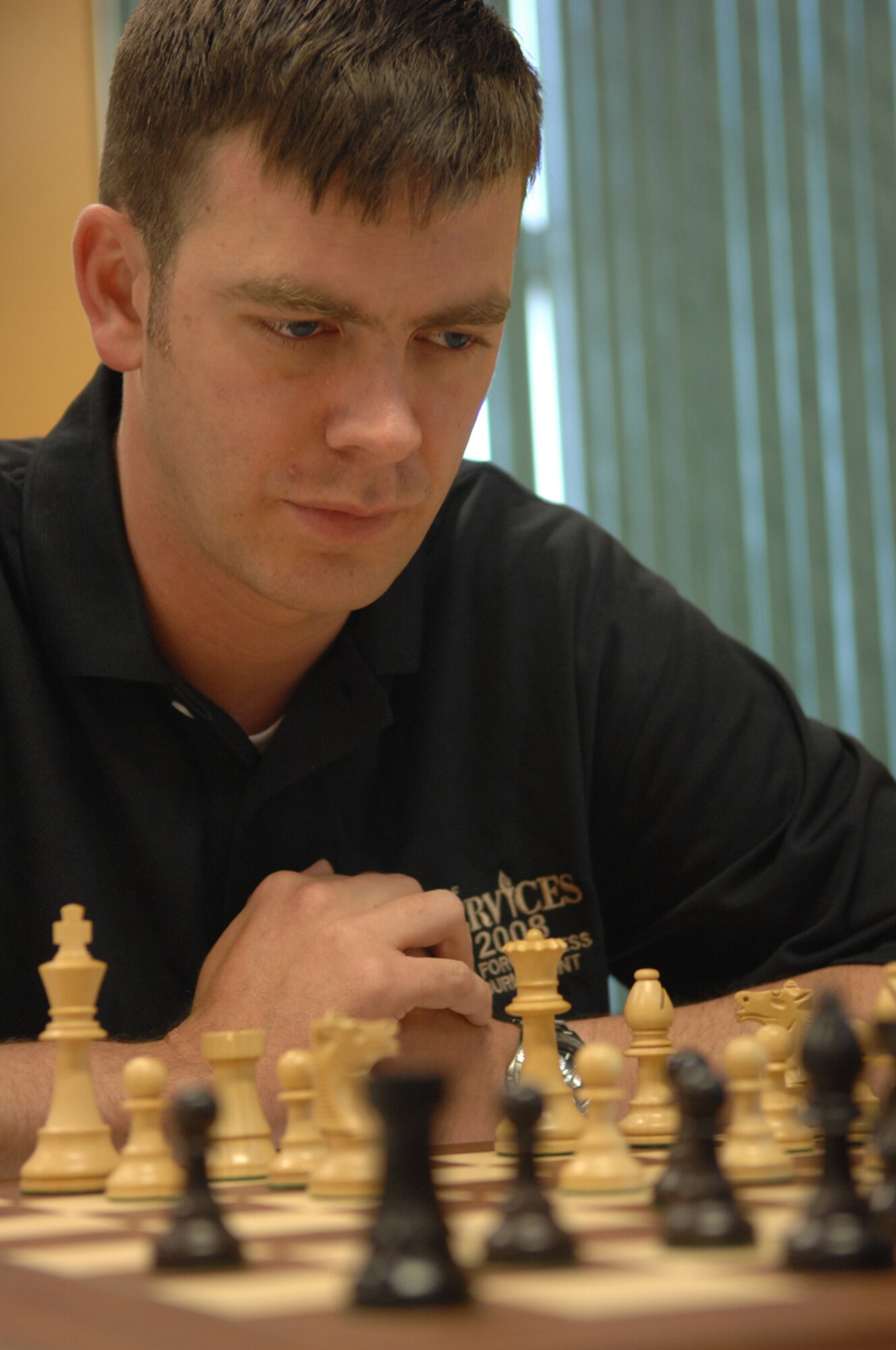 Tech. Sgt. Robert Keough thinks about his next move during the 2008 Air Force Chess Tournament held at the D-M Community Center May 7. Fourteen active duty Air Force members from around the globe, including two members from D-M, are competing in this year’s tournament. The top six players will advance and compete in the inter-service tournament which will be held here in June. Sergeant Keough is a member of the 563rd Operations Support Squadron.  (U.S. Air Force photo by Senior Airman Alesia Goosic)