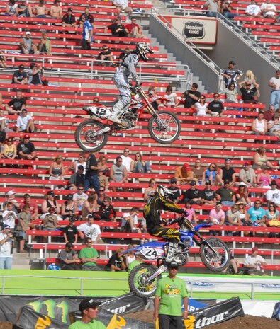 LAS VEGAS--American Motorcyclist Association Supercross rider Heath Voss passes another rider in midair during qualifying for the final round of the 2008 Supercross championship in Las Vegas, May 3.  Mr. Voss, who carries the Air Force logo on his bike, uniforms and transporter, is the 2004 Supercross world champion. The Air Force is a major sponsor of the Supercross series. (U.S. Air Force photo/Chief Master Sgt. Gary Emery)