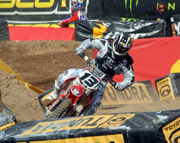 LAS VEGAS--American Motorcyclist Association Supercross rider Heath Voss bends his bike into a turn during qualifying for the final round of the 2008 Supercross championship in Las Vegas, May 3. Mr. Voss carries the Air Force logo on his bike, uniforms and transporter even though he receives no official sponsorship from the Air Force. The Air Force is a major sponsor of the Supercross series. (U.S. Air Force photo/Chief Master Sgt. Gary Emery)